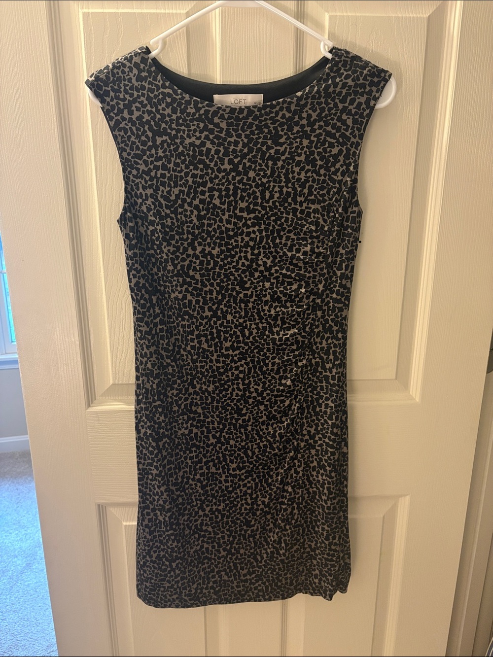 LOFT sleeveless dress features a distinct black/ brown animal print